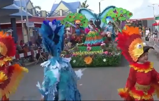 Aruba TV Plus - Colorful Aruba Carnival parade with elaborate bird costumes featured on ArubaTV